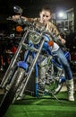 Impressive woman on a motorcycle at moto show Royalty Free Stock Photo