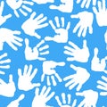 Imprint of children s palms and feet. Seamless pattern. Royalty Free Stock Photo