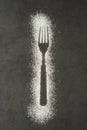 Imprint fork silhouette made of flour on a black backgraund. Gluten free concept. Lose weight, dieting, healthy food