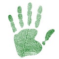 Imprint of a human palm with a pattern of a green leaf of a tree.