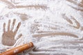 Imprint on palm flour and rolling pin horizontal
