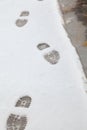 Imprint of shoes on white snow Royalty Free Stock Photo