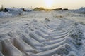 Imprint tractor in snow on cleared site for Royalty Free Stock Photo