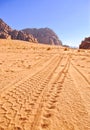 Imprint wheels jeep on sand