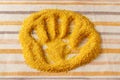 Imprint of a woman's hand in bulgur, background, concept.