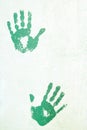 Handprints on the plastered wall