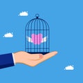 Imprisoned and controlled savings. Lock the piggy bank in the birdcage. concept of business Royalty Free Stock Photo