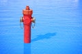 An improbable hydrant in the ocean. Plenty of water: concept image