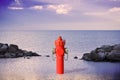 An improbable hydrant at the seaside. Plenty of water concept image Royalty Free Stock Photo