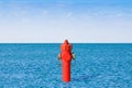 An improbable hydrant at the seaside. Plenty of water concept image