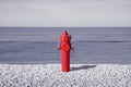 An improbable hydrant at the seaside. Plenty of water concept image Royalty Free Stock Photo