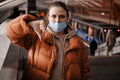 Improperly worn face mask on a woman in public transport, subway Royalty Free Stock Photo