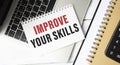 Improve your skills word on office table with computer, coffee, notepad, smartphone Royalty Free Stock Photo