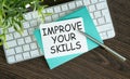 Improve your skills word on office table with computer, notepad, smartphone and digital tablet. Royalty Free Stock Photo