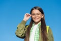 Improved vision is possible. Happy kid wear glasses on sunny blue sky. Defective vision. Childs vision correction