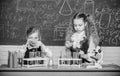 Improving their study skills. Study group in chemistry laboratory. Little school children holding test tubes during