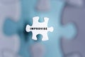 Improvise word on puzzle pieces isolated on blurred blue background. Royalty Free Stock Photo