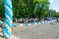 improvised outdoor auditorium fenced with white and blue balloons Royalty Free Stock Photo