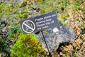 Improvised sign warning visitors to the gardens to stay off the rocks.