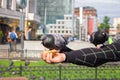 Impudent pigeons eat bread from hands of tourists. Feeding of city birds. Walk around the city