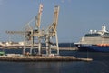 Massive cranes at the docks in Lanzarote with the celebrity Silhouette in the background