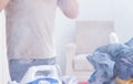 Inattentive husband burning clothing while ironing Royalty Free Stock Photo