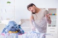 The inattentive husband burning clothing while ironing Royalty Free Stock Photo