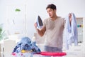 The inattentive husband burning clothing while ironing Royalty Free Stock Photo