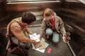 Inattentive woman dropping documents on the floor in elevator Royalty Free Stock Photo