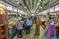 interior of the municipal market of LoulÃ© in the Algarve region during the afternoon with customers and vendors.