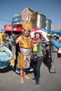 Inca man with a happy tourist girl at parade, Bolivia