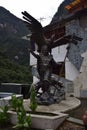 Inca statue with an eagle on the square in Aguas Calientes, Peru