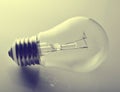 Incandescence light bulb close-up on a gray background. Royalty Free Stock Photo