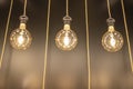 3 incandescent bulbs hanging with wires, Abstract background