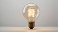 An incandescent lamp glows on a white background. Isolated