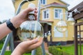 Incandescent lamp in hands close-up. Backyard cleaning Royalty Free Stock Photo