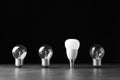 Incandescent and LED lamp bulbs on grey table Royalty Free Stock Photo