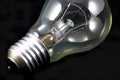 Incandescent light bulb on black Royalty Free Stock Photo