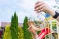 An incandescent light bulb in a childÃ¢â¬â¢s hands, a close-up. Garden cleanup Royalty Free Stock Photo