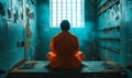 Incarcerated person in orange jumpsuit sitting alone in a bleak prison cell, gazing out of the barred window, evoking themes Royalty Free Stock Photo