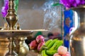 Incense on the brass candlestrick with the smoke out from incense Royalty Free Stock Photo