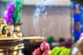 Incense on the brass candlestrick with the smoke out from incense Royalty Free Stock Photo