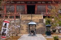 Incense burner and stairs leading to entrance of historic Japanese shrine