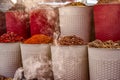 Incense burning alongside coloured spices for sale in Dubai Creek Souk, UAE