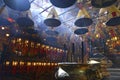 Incense burning with lanterns in dimly lit, traditional Temple in Hong Kong