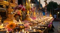 Incense, flowers, and candles on a Thai altar. Spiritual offerings in a temple for Visakha Bucha. Concept of Buddhist Royalty Free Stock Photo