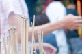 Incense joss stick burning slowly with fragrant smell smoke. People praying on Chinese Buddhist temple on Chinese new year, Luna n Royalty Free Stock Photo