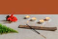 incense with orange flower and candles on display Royalty Free Stock Photo