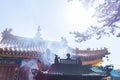 Incense smoke rising in a temple Royalty Free Stock Photo