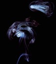 Incense smoke spiral colors on black background